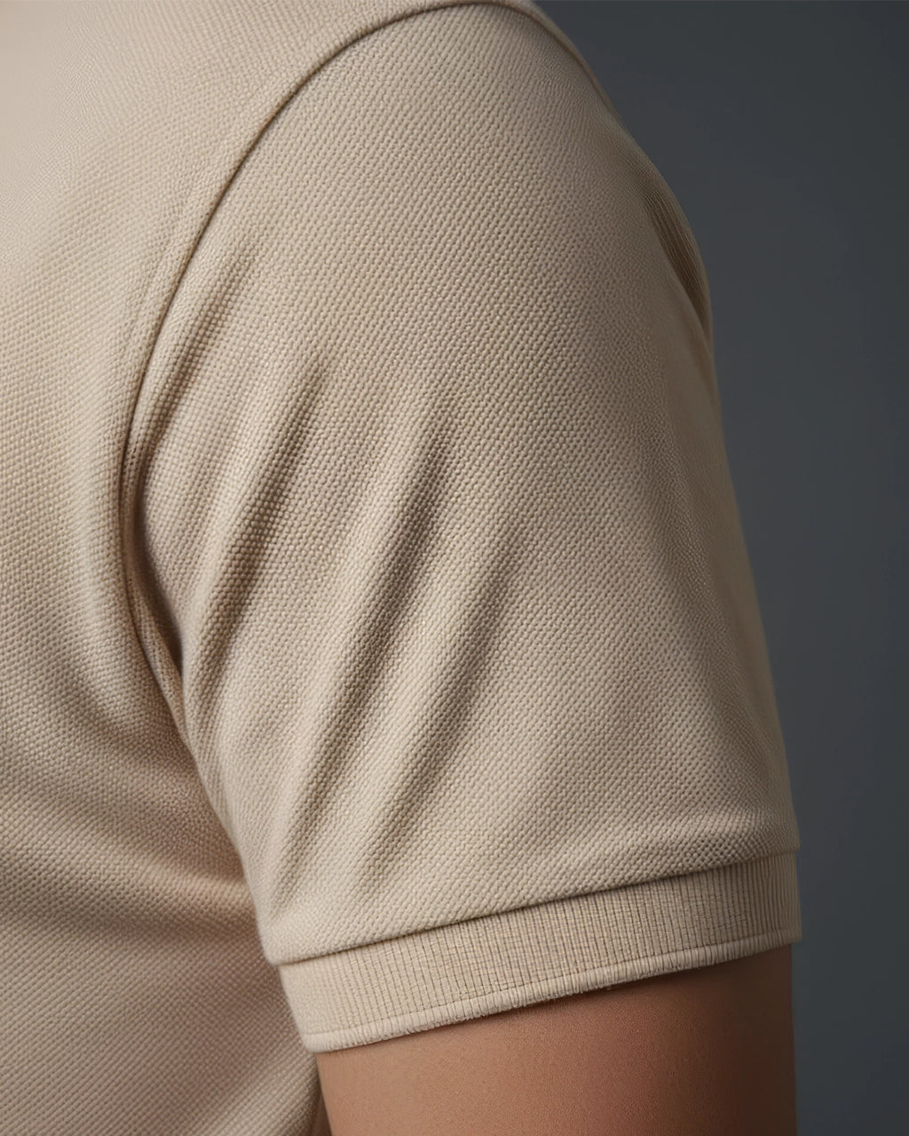 Beige polo t shirt sleeve close up