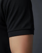 Black polo t shirt sleeve close up
